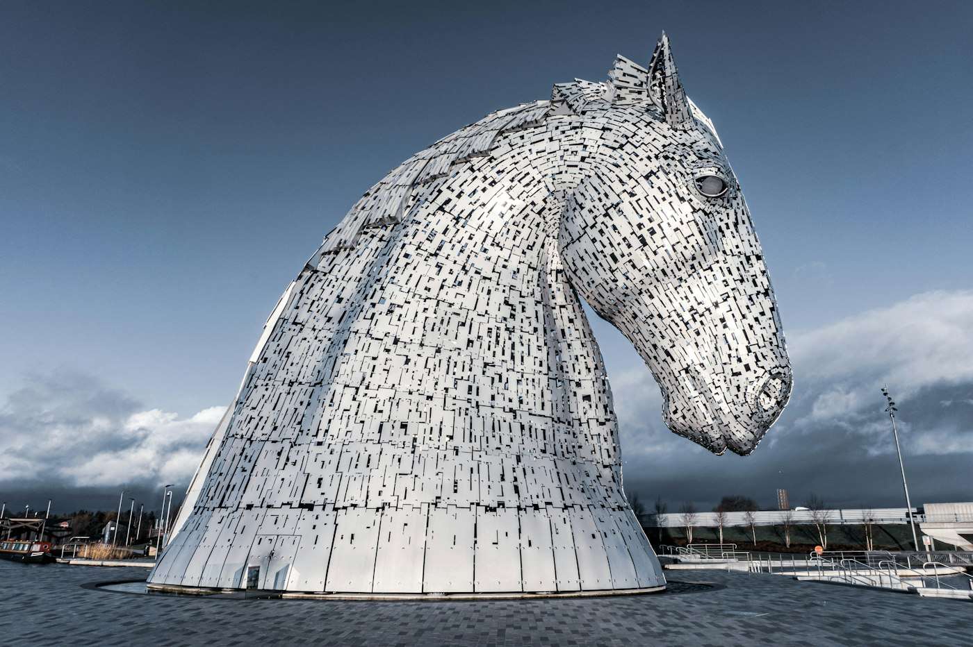 A stainless steel head of the Kelpies rising against the sky at Falkirk